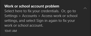 Toast notification showing: Work or school account problem. Select here to fix your credentials. Or, go to Settings > Accounts > Access work or school settings, and select Sign in again to fix your work or school account.